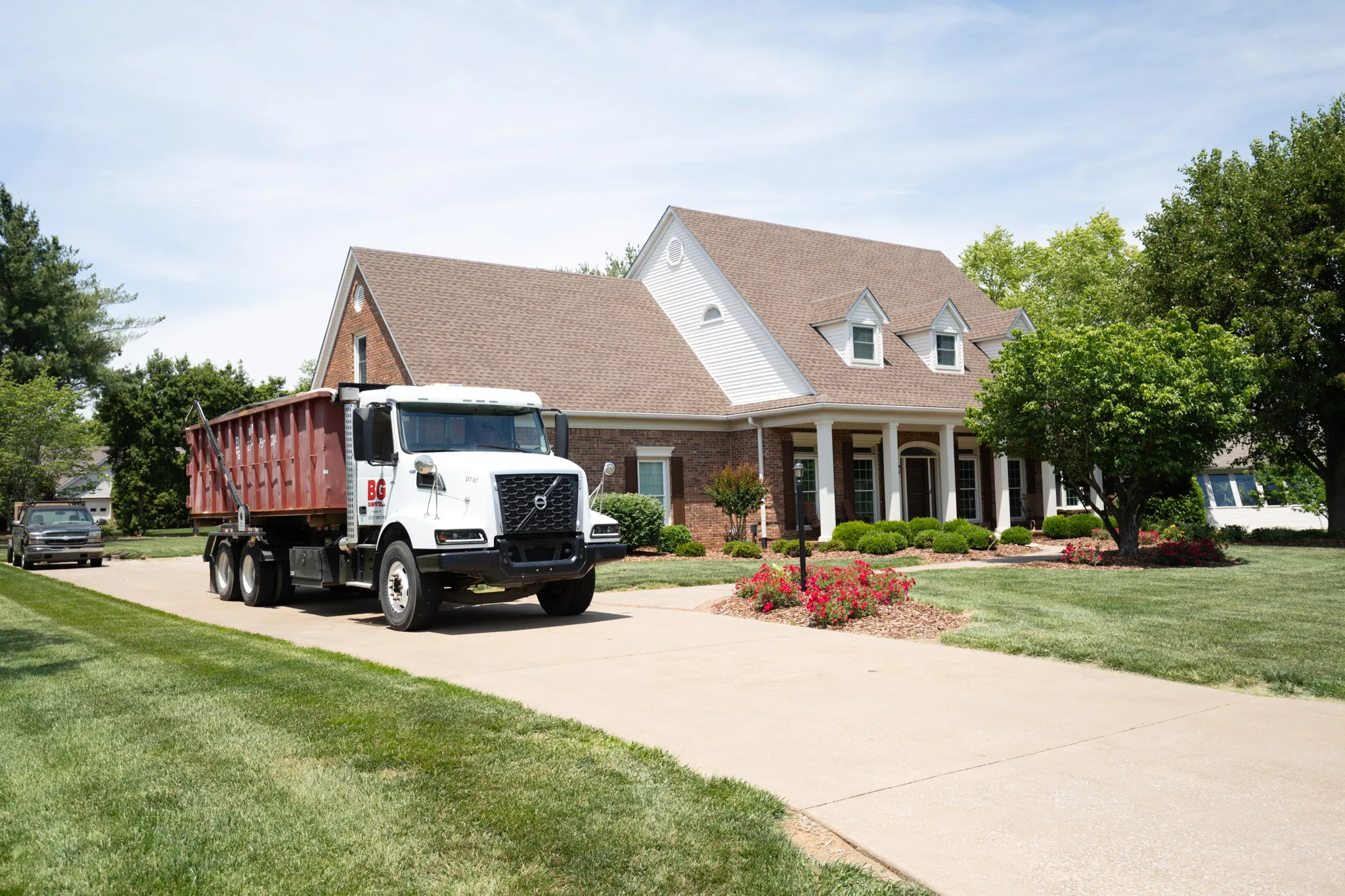 Roll-off dumpster placed on a residential driveway